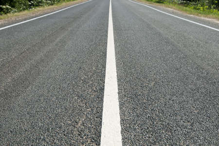 Middle of the asphalt road with markingの写真素材