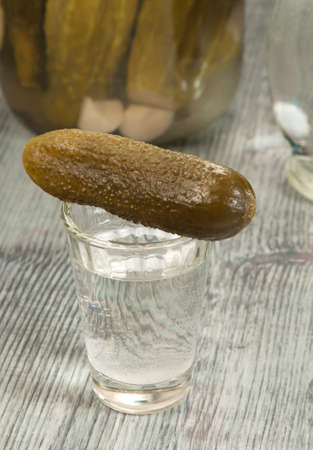 Salted cucumbers - a traditional russian appetizer to vodkaの写真素材