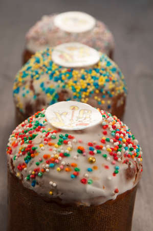 Three Easter cakes on a wooden table
