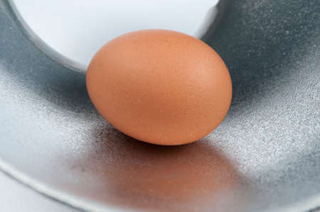 Hen's egg on a metal surfaceの写真素材