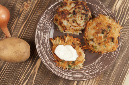 Potato flapjack (draniki) with sour creamの写真素材