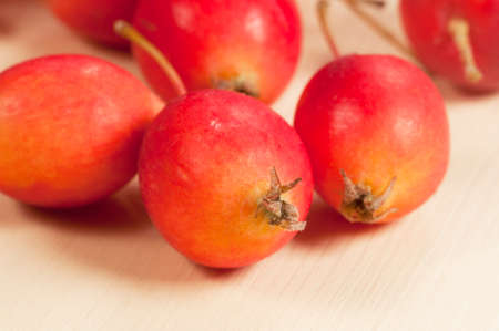 Crab (Paradise) apples on a wood board, autumn picture