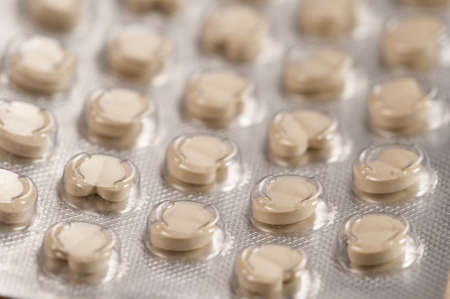 Many grey Tablets in blister, macro shot, local focusの写真素材