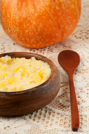 Rice kasha with pumpkin in a timber bowlの写真素材