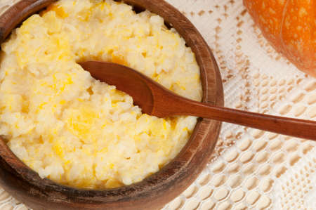 Rice kasha with pumpkin in a timber bowlの写真素材
