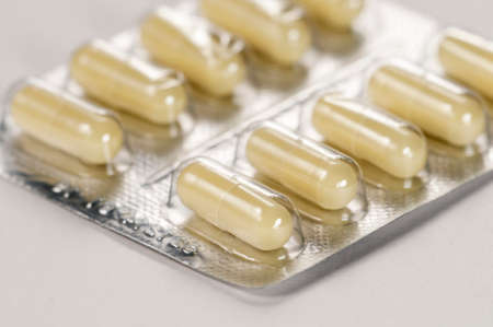 Capsulas in blister over light background, macro shot