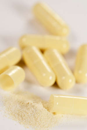 Capsulas of antibiotic over light background, macro shotの写真素材