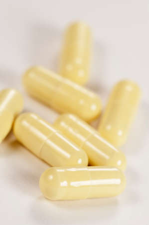 Capsulas of antibiotic over light background, macro shotの写真素材