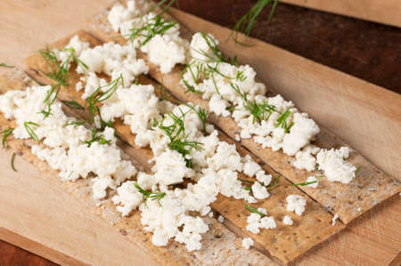 Crisp bread with curd and dill, close upの写真素材