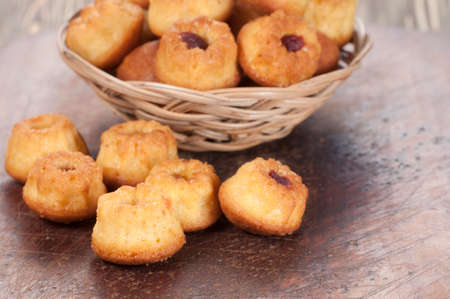Cakes with jam in a basket, closeup shot