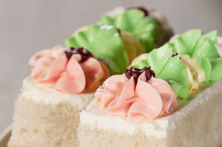 Angel cake with cream flowers, close up