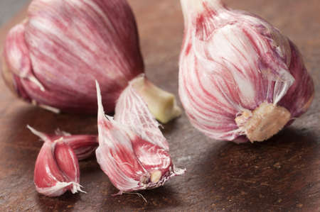 Garlic on a timber tableの写真素材