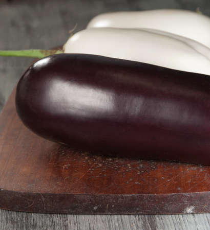 Egg fruits white and dark on a timber boardの写真素材