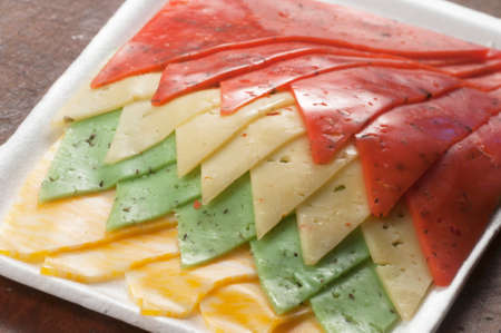 Cheese assort on a plate on a timber board, closeupの写真素材