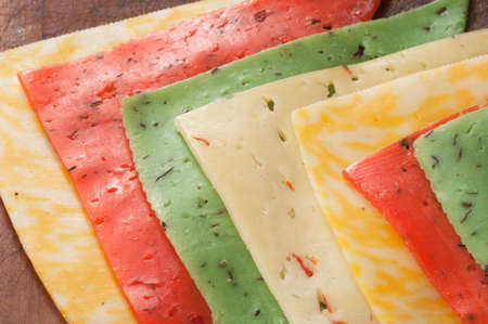 Cheese assort on a timber board, closeup