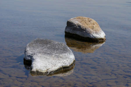 Big stones in clear river water - zen conceptの写真素材