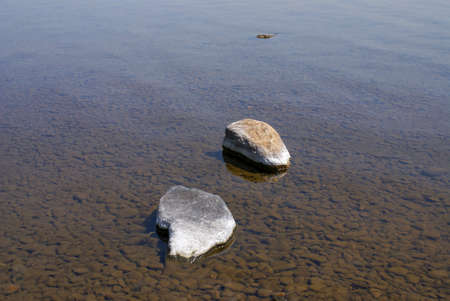 Big stones in clear river water - zen conceptの写真素材