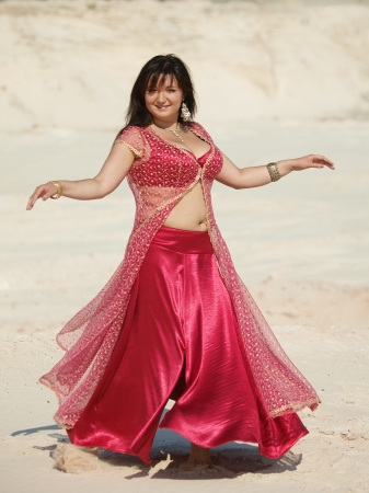 East dancer in red dressの写真素材