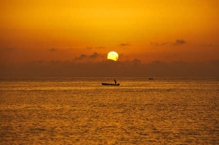Fisher in the boat  Mediterranean Sea, South Sicily の写真素材