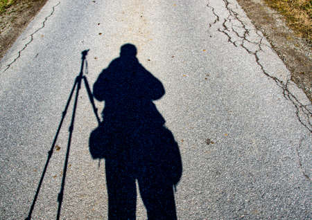 Photographer shadow on asphalt in Germany, Bavariaの写真素材