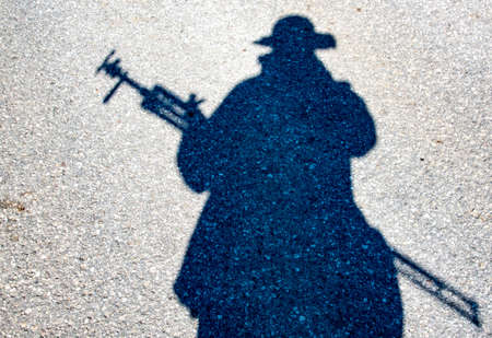 Photographer shadow on asphalt in Germany, Bavariaの写真素材