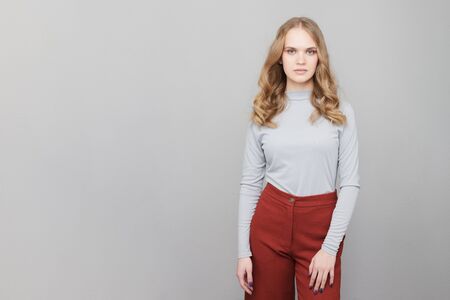 Three-quarter length portrait of a young woman.の写真素材