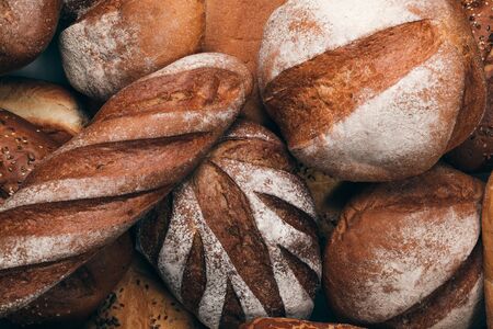 Bread wallpaper. Different kinds wholegrain baked breads top view close-up