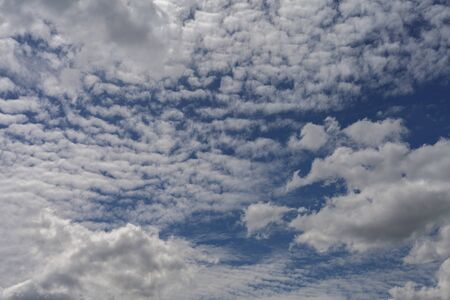Cirrus clouds against the blue summer sky.の写真素材