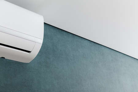 Air conditioner on green wall. Closeup image. Shallow dept of field.の写真素材