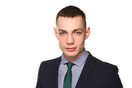 Charming handsome young man. Handsome caucasian man in necktie and suit isolated over white background.の写真素材