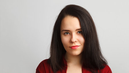 Young woman portrait. Studio shot, isolated over white background.の写真素材