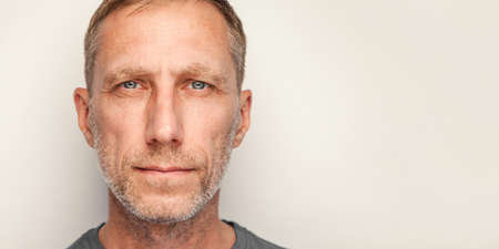 Male close-up studio portrait isolated against white background. Bearded man headshot.の写真素材