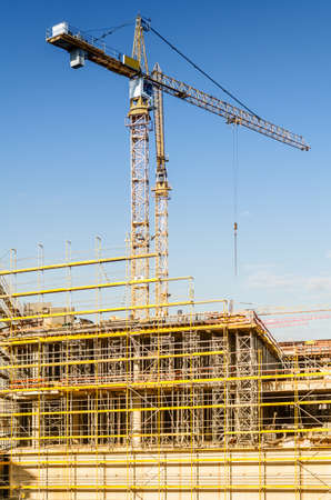 construction site with crane and blue skyの写真素材