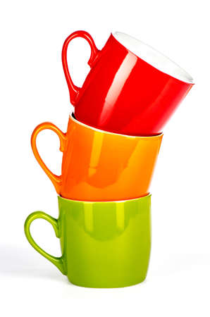 three stacked colored cups on a white backgroundの写真素材