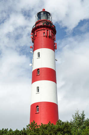 red white lighthouse on the north seaの写真素材