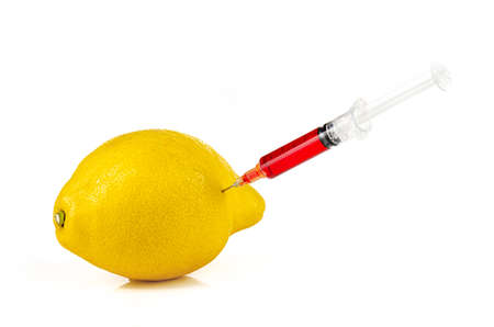 Lemon with injection of a red liquid
