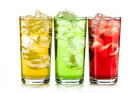 yellow, green and red drink with ice cubes on white background, isolatedの写真素材