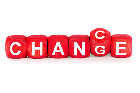 wooden cube with word change to chance, buildt from red dices, isolated on white backgroundの写真素材