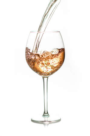 pouring a glass of rose wine,  isolated on white backgroundの写真素材