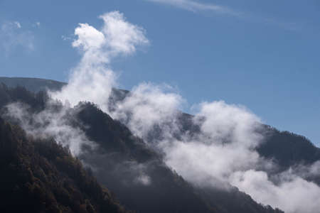 Caucasus, Georgia, Tusheti region, Omalo. Landscape view of caucasus mountains behing fog in Georgiaの写真素材