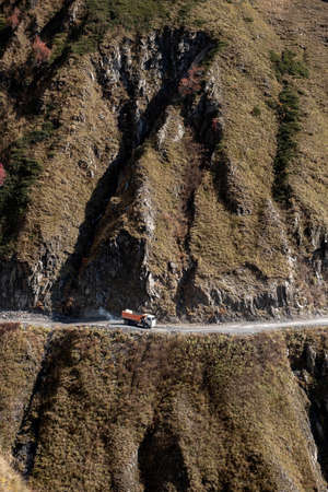 Caucasus, Georgia, Tusheti region, Omalo. A truck follows a dangerous road down the mountain from Omalo to Alvani in Georgiaの写真素材