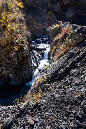 Caucasus, Georgia, Tusheti region, Omalo. Abandoned electric pole over water fall next to the road from Alvani to Omala - Tushetiの写真素材