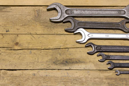 Set of wrenches on a wooden workbenchの写真素材