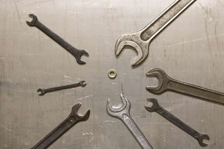 A set of wrenches on metal sheet