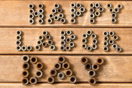 Labor day.  Different tools on a wooden table .の写真素材