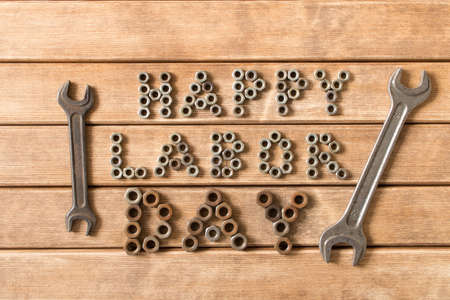 Labor day.  Different tools on a wooden table .の写真素材