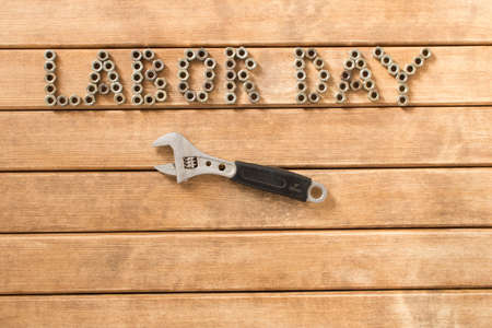 Labor day.  Different tools on a wooden table .の写真素材