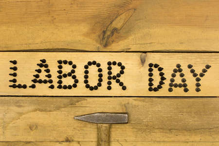 Labor day.  Different tools on a wooden table .の写真素材