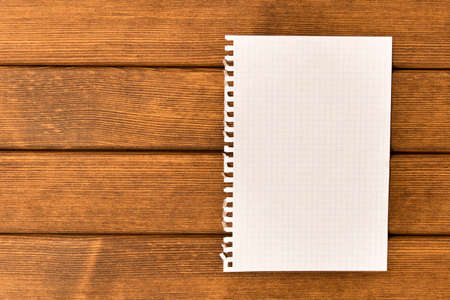 Clean sheet of paper  on wooden background . Concept .