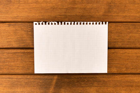Clean sheet of paper  on wooden background . Concept .